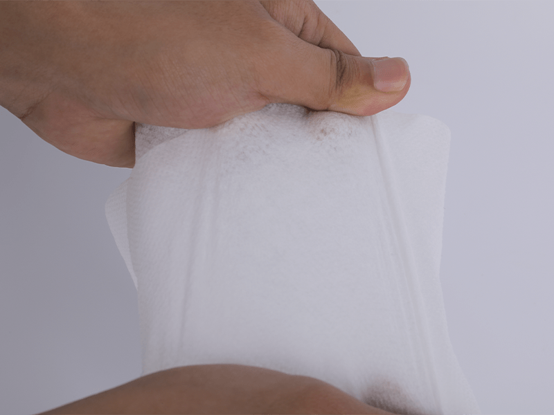 Elastisk nonwoven Huvudsakligen vit och hudfärg